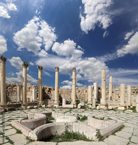 Roman ruins (against the background of a beautiful sky with clouds) in the Jordanian city of Jerash (Gerasa of Antiquity), capital and largest city of Jerash Governorate, Jordan #762358287