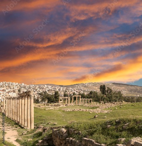 Roman ruins (against the background of a beautiful sky with clouds) in the Jordanian city of Jerash (Gerasa of Antiquity), capital and largest city of Jerash Governorate, Jordan #762358447