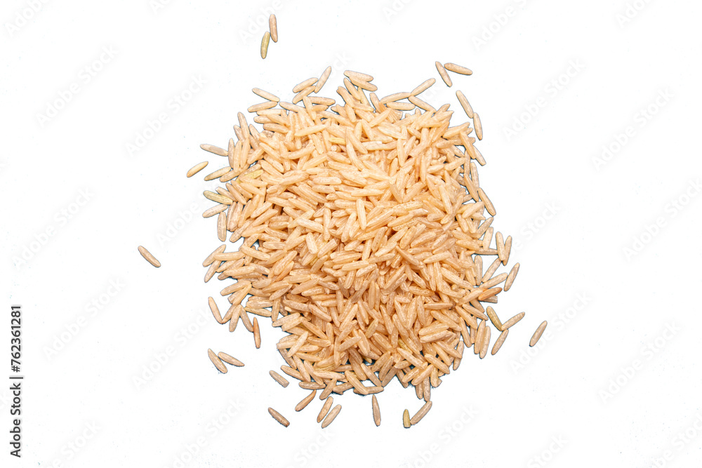 Whole grain uncooked basmati rice heaped on empty background
