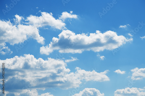 Fototapeta Naklejka Na Ścianę i Meble -  Blue sky background with fluffy white clouds