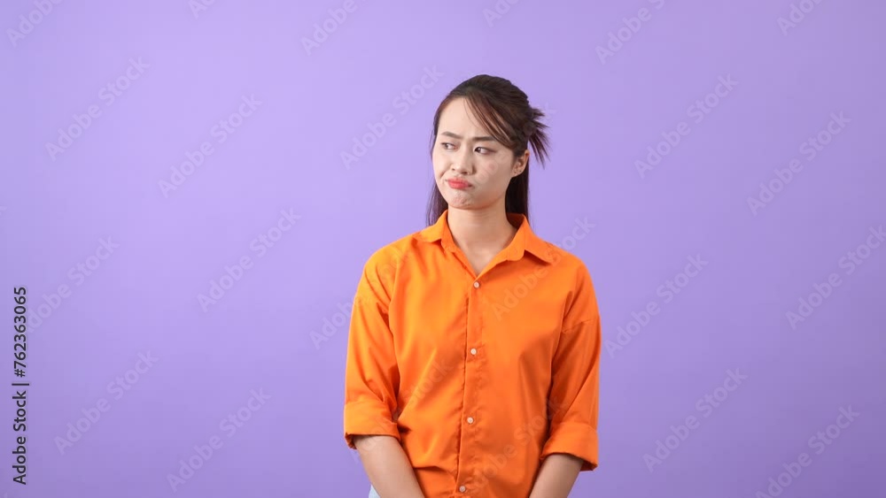 The Asian woman pondered her plan and finally shrugged her shoulders at the impasse
The Asian woman pondered her plan and finally shrugged her shoulders at the impasse