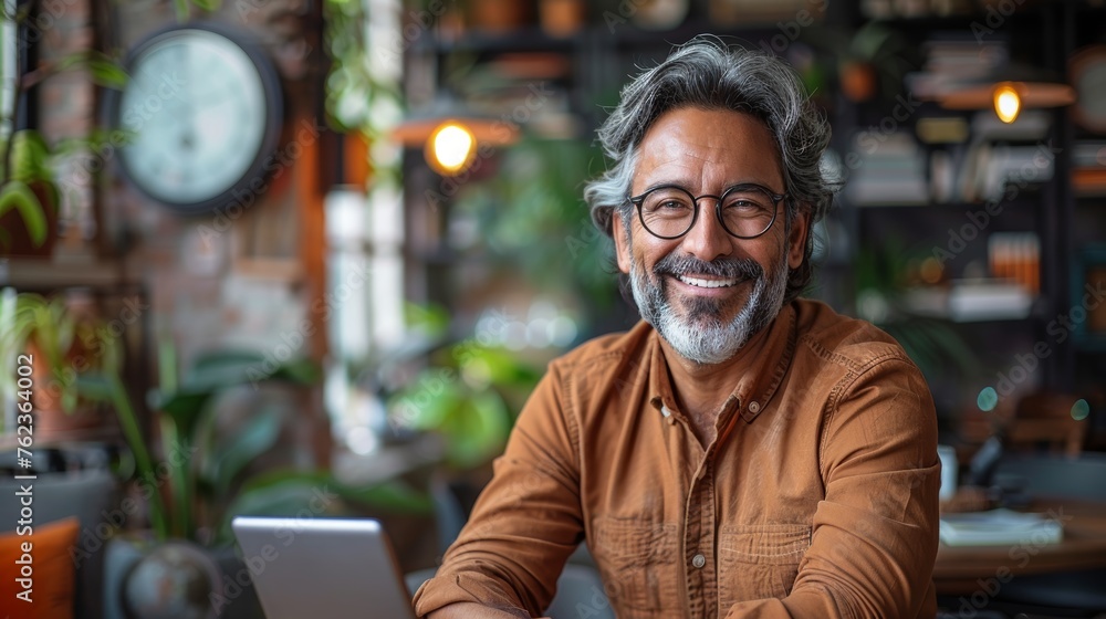 Smiling mature man businessman holding smartphone sit in office working online Smiling mature man businessman holding smartphone sit in office working online