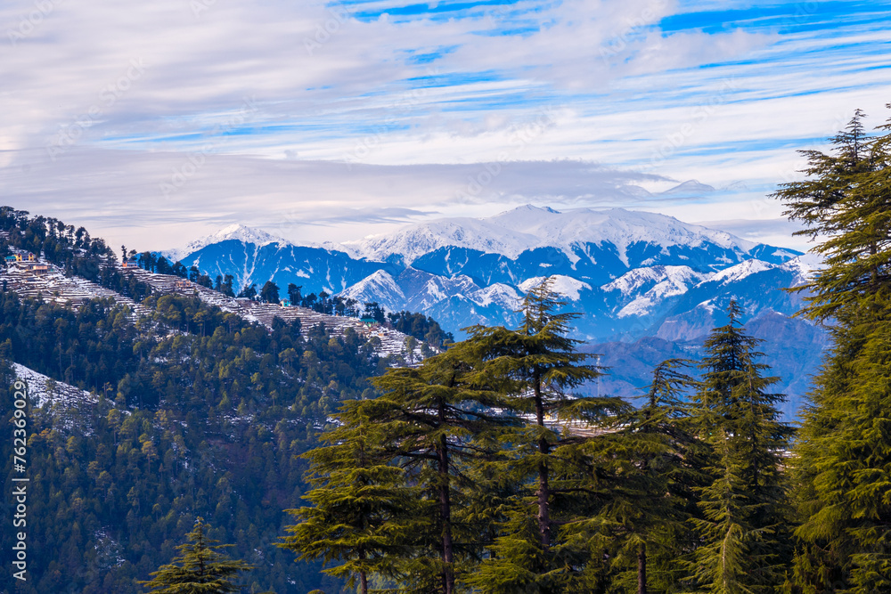 Landscape with snow. A scenic village in the backdrop of the Himalayan mountains. Chamba, Himachal Pradesh, India. 