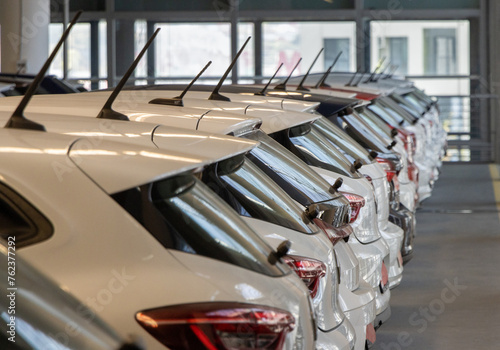 Used car sales. Cars in a row. Car Dealer Inventory Indoor garage