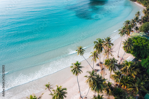 Aerial Beach and coconut trees on a calm island in the morning photo