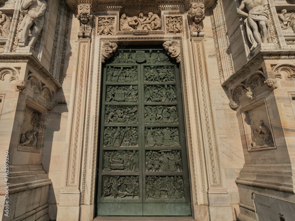 Door, sculptures and details on Milano dome, Lombardy, Italy.