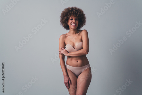 Unretouched photo of body positive girl touch hands feel confident self imperfection isolated pastel color background
