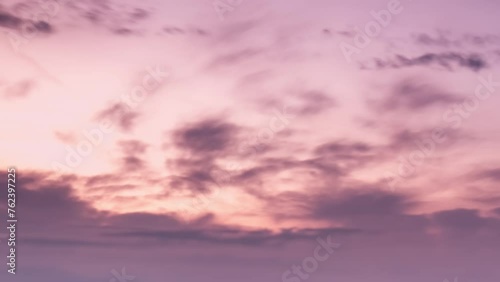 Pink orange and purple cirrus clouds in the sky - Colorful sunset timelapse (ID: 762397225)