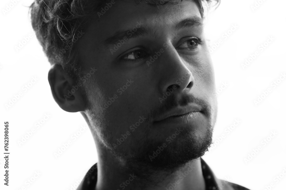 A black and white close-up portrait of a young man A black and white close-up portrait of a young man