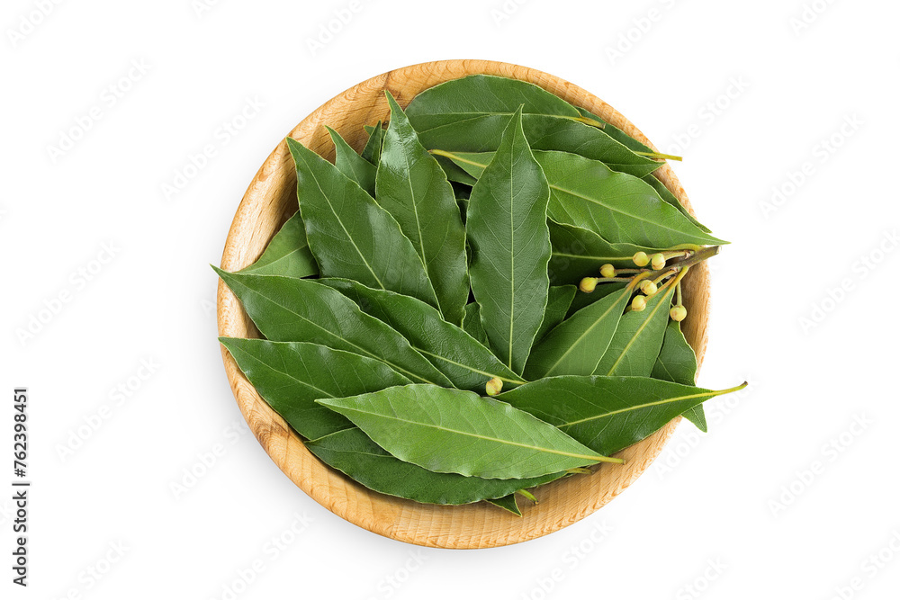 Fresh Laurel leaves in wooden bowl isolated on white background. Green bay leaf. Top view. Flat lay. Fresh Laurel leaves in wooden bowl isolated on white background. Green bay leaf. Top view. Flat lay.