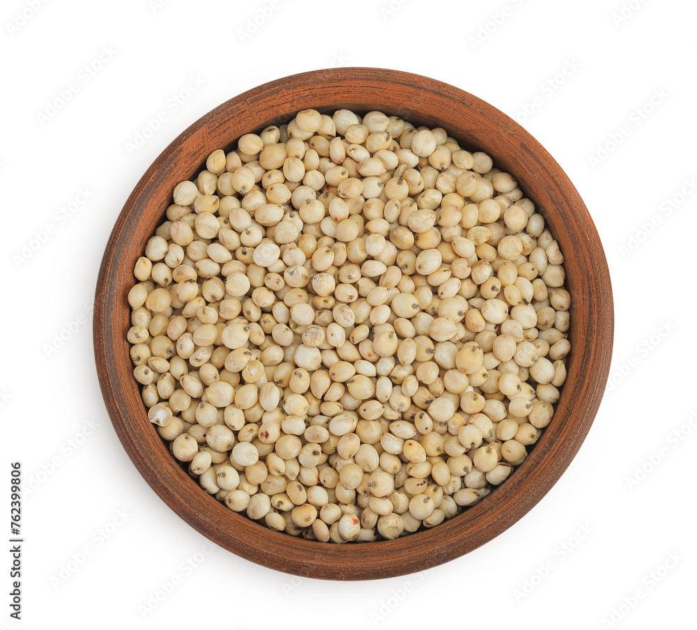 Sorghum seeds in ceramic bowl isolated on white background. Top view. Flat lay. Sorghum seeds in ceramic bowl isolated on white background. Top view. Flat lay.