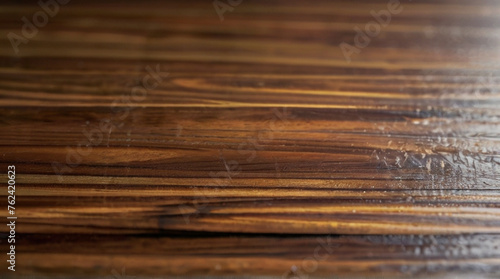 A Beautiful wooden background detailed closeup of a beautiful brown hardwood table with a grainy texture, showcasing the natural pattern of the wood Background.  © Sumon