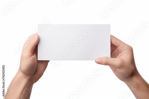 A hand holding a white paper isolated on white background