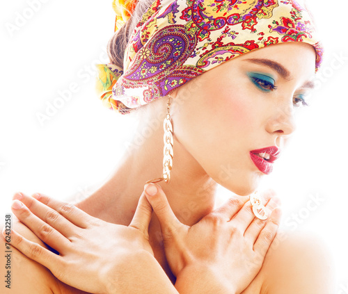 Tableau sur toile young pretty modern girl with bright shawl on head emotional posing isolated on
