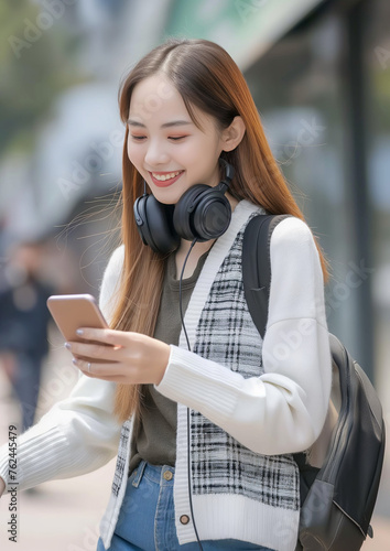 Happy Young Woman with Smartphone on Bike