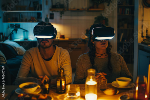 young couple sitting at a table wearing virtual reality glasses