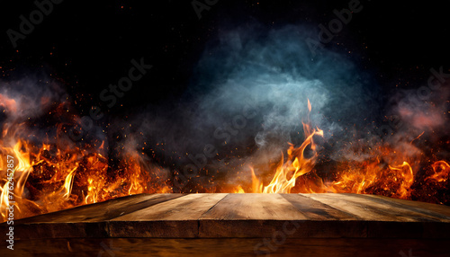 wooden table with Fire burning at the edge of the table, with fire flames on a dark background to display products 