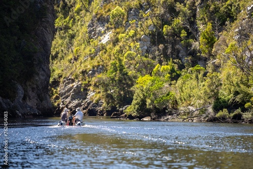 exploring up a river in a boat in a wilderness area in australia