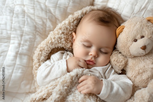 Serene infant sleeps cozily with a plush toy on a white bedspread