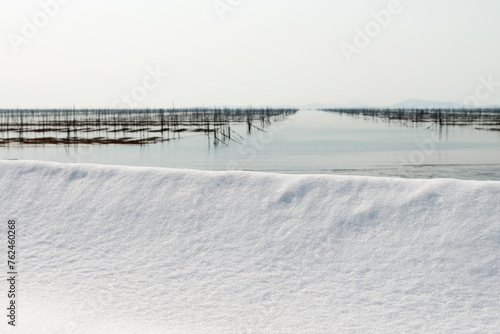 Snowy seaside at the laver seaweed farm © 안구정화