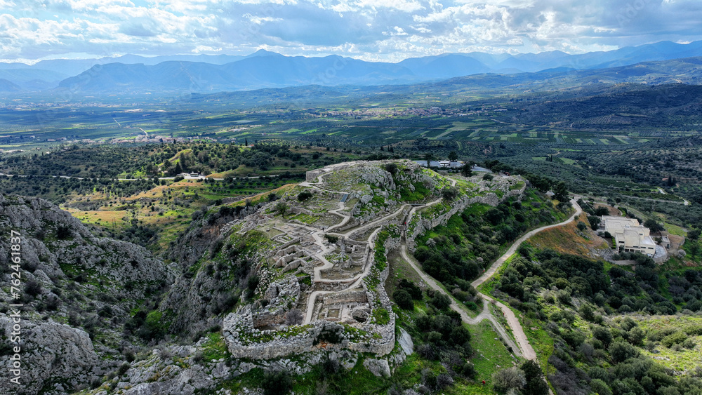 Aerial drone scenic photo of uphill iconic archaeological site of Ancient citadel of Mycenae famous for round tomb of Agamemnon and Lion Gate, Argolida, Peloponnese, Greece