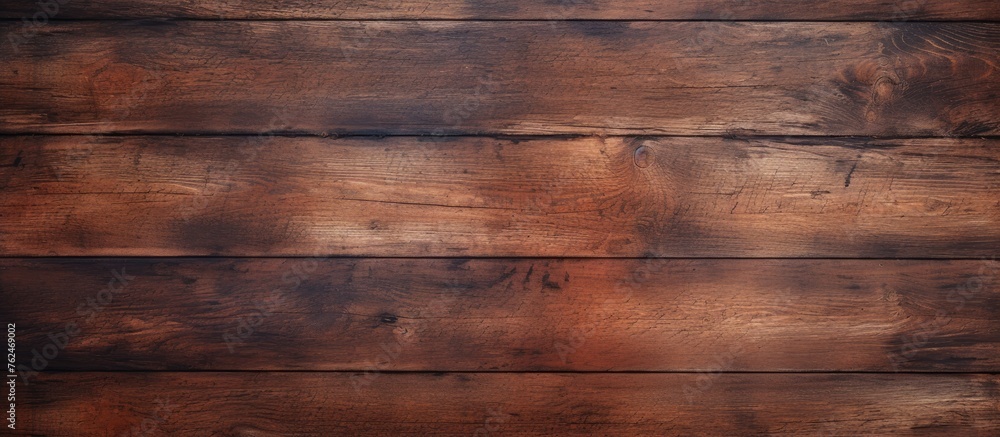 A closeup of a rectangular brown hardwood plank table with a beautiful wood grain pattern and amber wood stain. The blurred background adds to the allure of the flooring - obrazy, fototapety, plakaty 