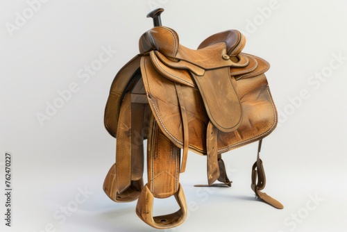small saddle with tan leather straps