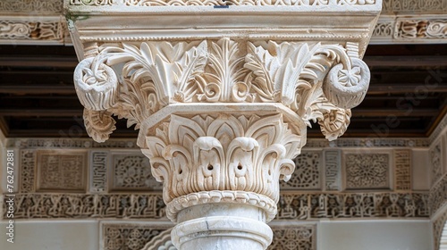 Marble capitals and stucco decoration of the portico in Patio del Cuarto Dorado in Mexuar in Comares Palace Alhambra, Andalusia, Spain. Magic breathtaking carved decoration in orient style. photo