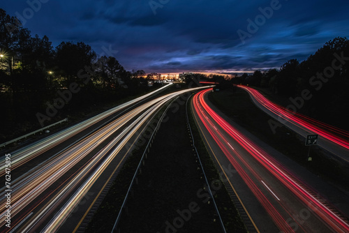 Car trails at evening on 147 Freeway at Durham, NC-USA on March 2024.