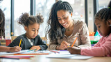African American female teacher and little children in classroom writing or drawing on paper