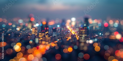Aerial shot of a cityscape at night  with the lights of buildings and vehicles blending into a breathtaking bokeh panorama