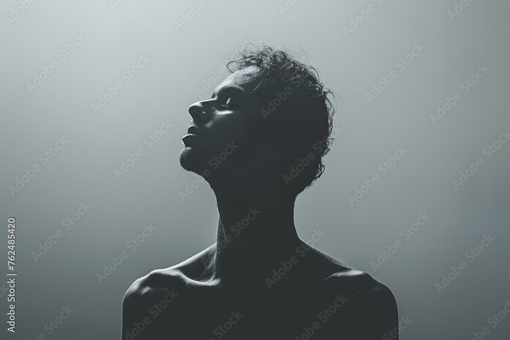 A artistic portrait featuring a shirtless man, conveying mysterious essence.