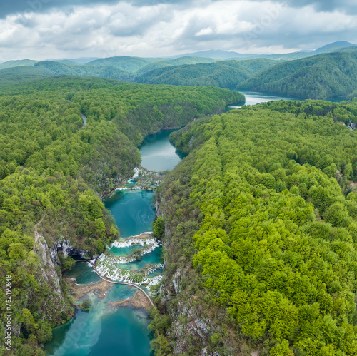 Amazing aerial view of Plitvice national park with lakes and picturesque waterfalls in a green spring forest, Croatia.