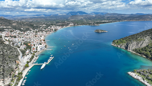 Aerial drone photo of famous seaside village small port and long sandy beach of Tolo with hotels and resorts built by the sea, Argolida, Peloponnese, Greece