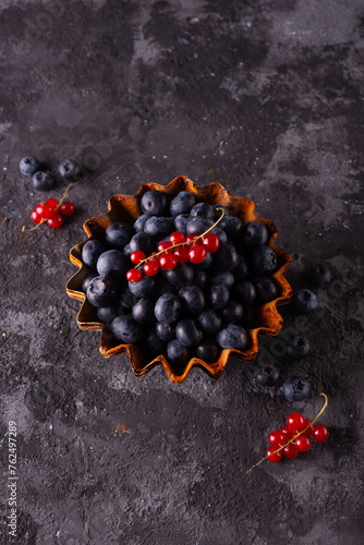 minimalistic still life of berries on an abstract background in a rustic style