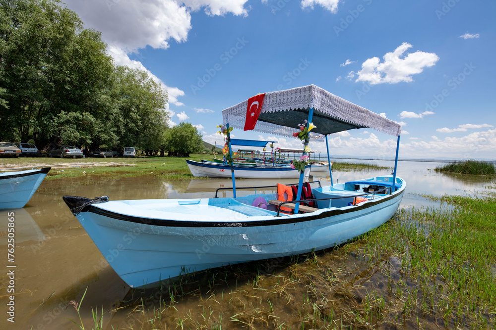 Decorated day-trip boats in Isikli Lake in Denizli's Civril district. Isıkli Lake is flooded with visitors during lotus time. It is also a popular lake for hunters. Decorated day-trip boats in Isikli Lake in Denizli's Civril district. Isıkli Lake is flooded with visitors during lotus time. It is also a popular lake for hunters.