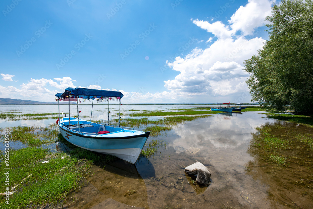 Decorated day-trip boats in Isikli Lake in Denizli's Civril district. Isıkli Lake is flooded with visitors during lotus time. It is also a popular lake for hunters. Decorated day-trip boats in Isikli Lake in Denizli's Civril district. Isıkli Lake is flooded with visitors during lotus time. It is also a popular lake for hunters.