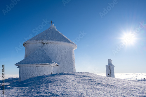 summit of Sniezka mountain in Giant mountains during winter in sunny day