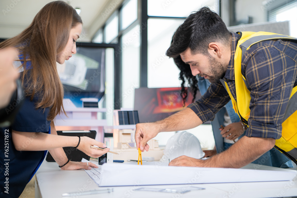 Obraz premium Engineers, architects, and designers collaborate to design a building that employs natural energy.