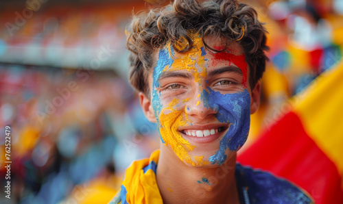 Vibrant Portrait of a Joyful male Romania Supporter with a Romanian Flag Painted on His Face, Celebrating at UEFA EURO 2024 photo
