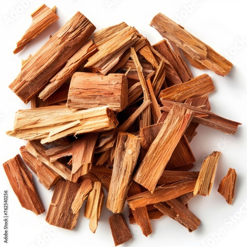 Pile of sandalwood chips isolated on white background. From above. photo