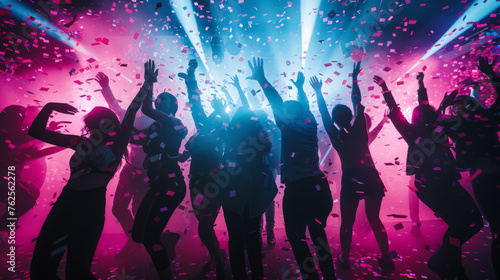 Silhouetted figures dance amidst confetti and colorful lights.