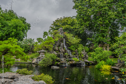 Serene Waterfall Pond at Thien Mu Pagoda, Hue, Vietnam