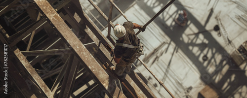 a man works at a height on a construction site