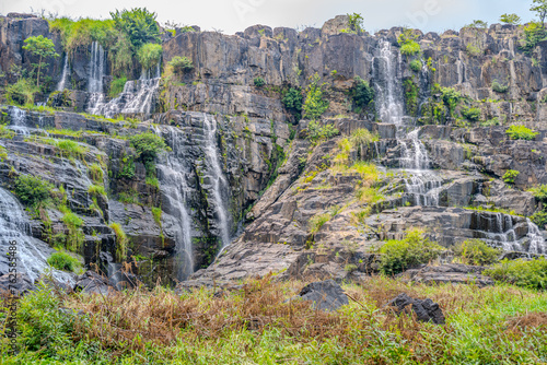 Splendid Pongour Waterfall Cascading Down Rocky Cliffs in Duc Trong, Lam Dong, Vietnam photo