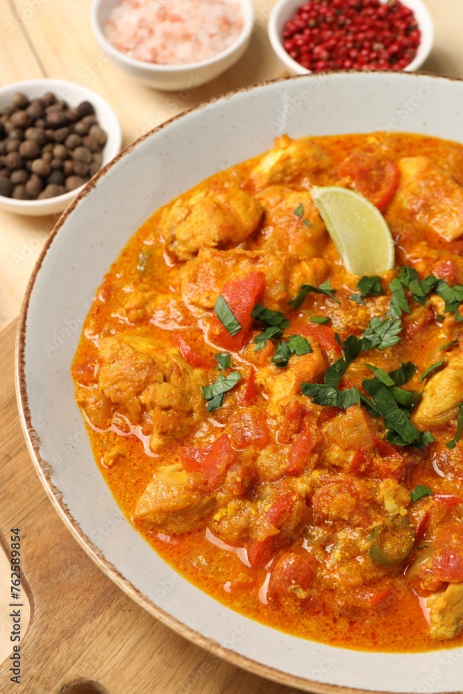 Delicious chicken curry and spices on table Delicious chicken curry and spices on table