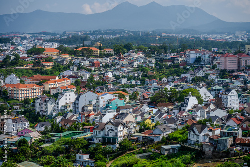 Fototapeta Naklejka Na Ścianę i Meble -  Panoramic View of Da Lat Cityscape with Mountains in Background, Vietnam