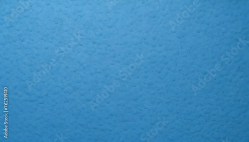 Blue textured paper background made of elephant poo. Colorful natural material wallpaper and background. Eco friendly materials in sustainable concept. Colorful and textured cover and background. photo