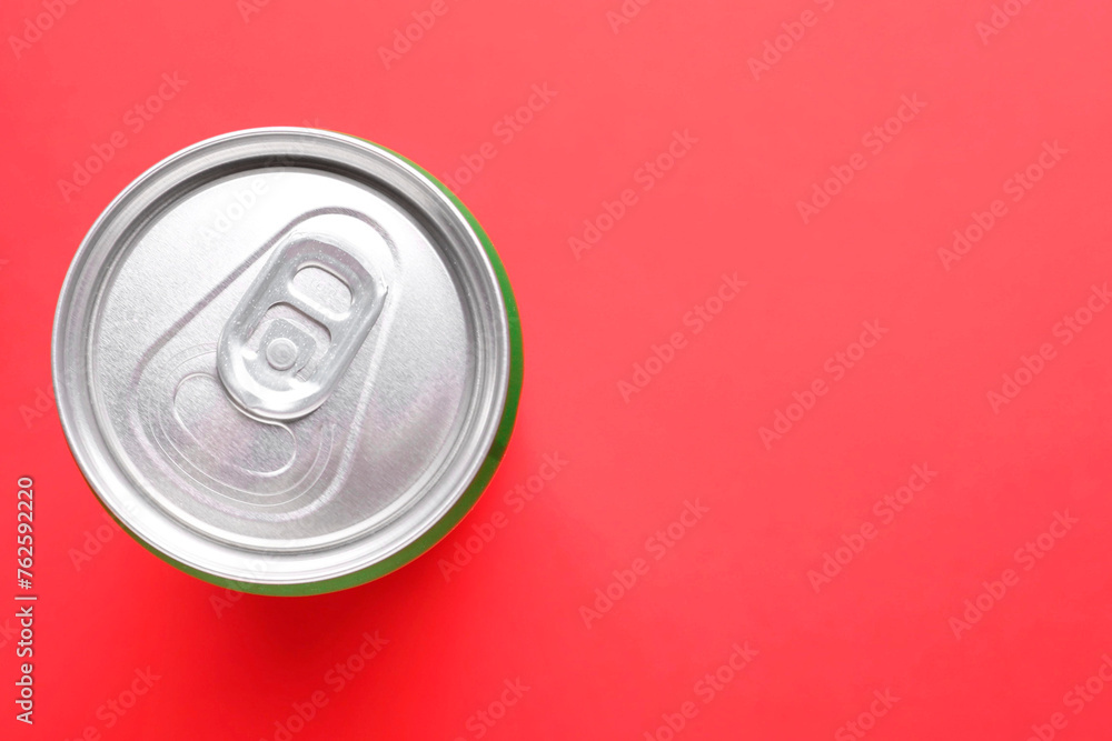 Energy drink in can on red background, top view. Space for text Energy drink in can on red background, top view. Space for text