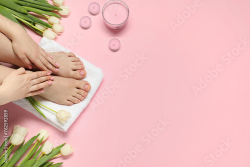 Closeup of woman with neat toenails after pedicure procedure on pink background, top view. Space for text